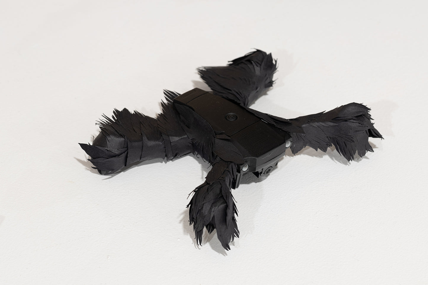 (drone entirely covered with paper feathers) by Stephanie Morissette