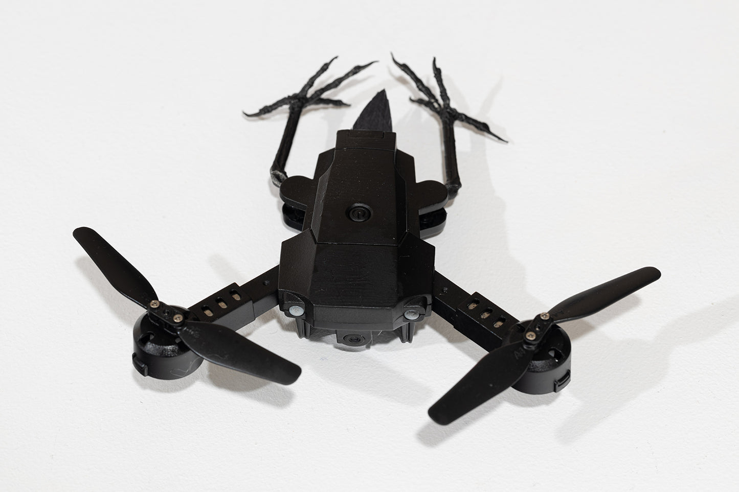 (drone with 2 propellers and 2 metal feet) by Stephanie Morissette