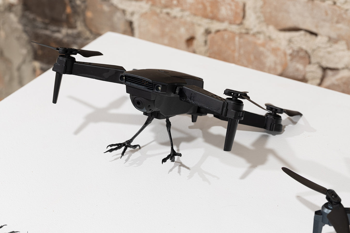 (drone with 2 propellers and 2 metal feet) by Stephanie Morissette